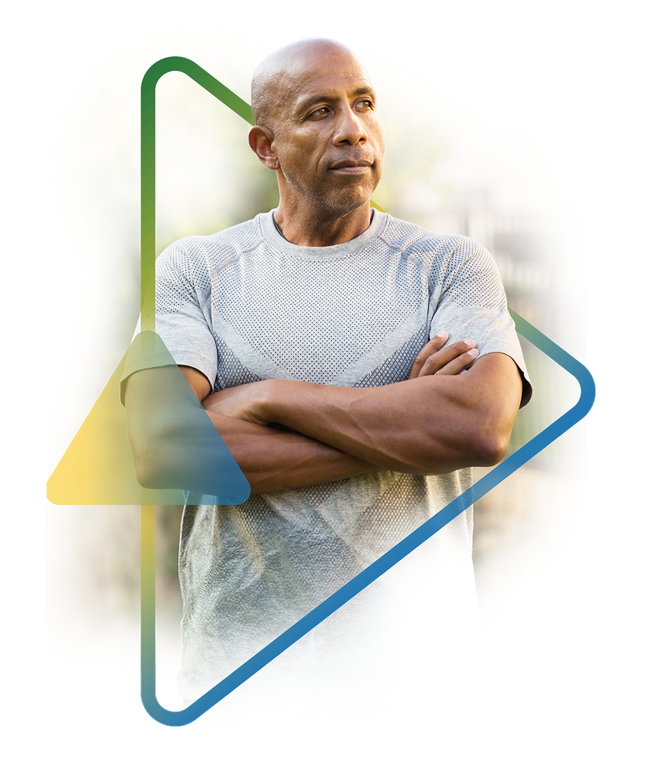 Mature man in gray t-shirt with crossed arms, framed by geometric design. Models are used for illustrative purposes only. 
