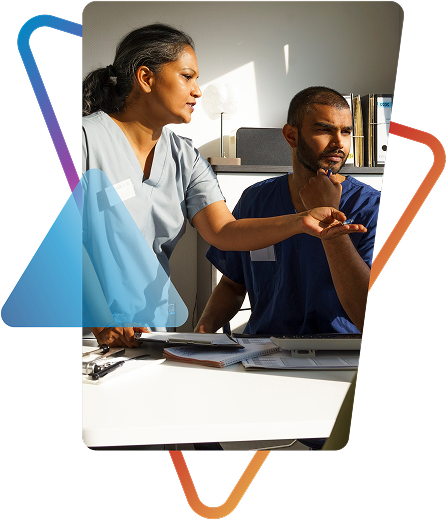 Healthcare providers in scrubs collaborating at workstation, framed by geometric design. Models are used for illustrative purposes only. 
