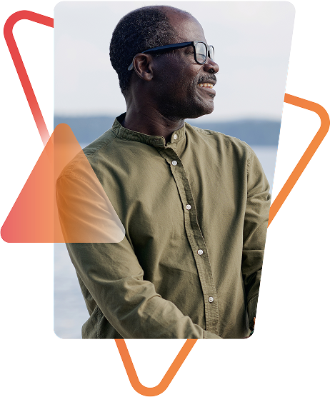 Man in olive shirt with glasses smiling, framed by geometric design. Models are used for illustrative purposes only. 