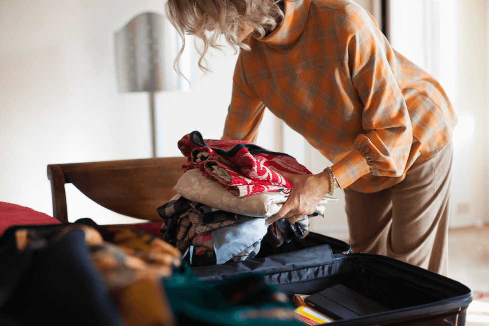 Woman packing a suitcase